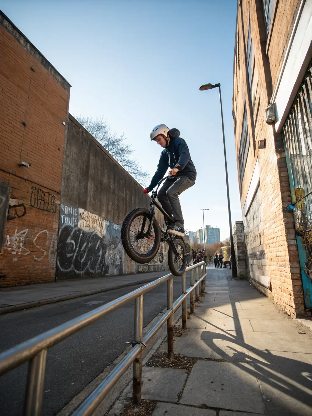 A young BMX rider performing a trick on a ramp at the KTC training facility, showcasing the energy and skill development fostered by KTC's programs.